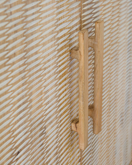 Close-up of wood door pulls on Dallinbury Accent Cabinet