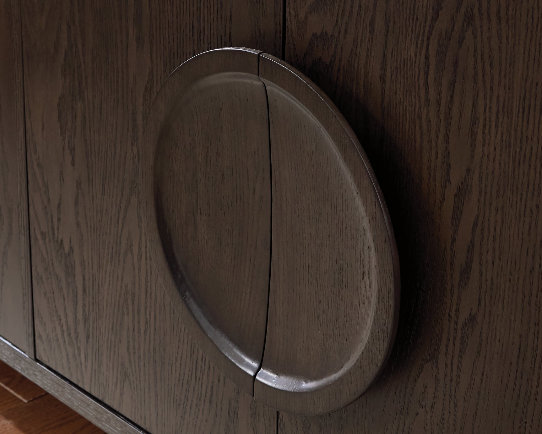 Close-up of Circular Door Pulls on Veeda Cabinet