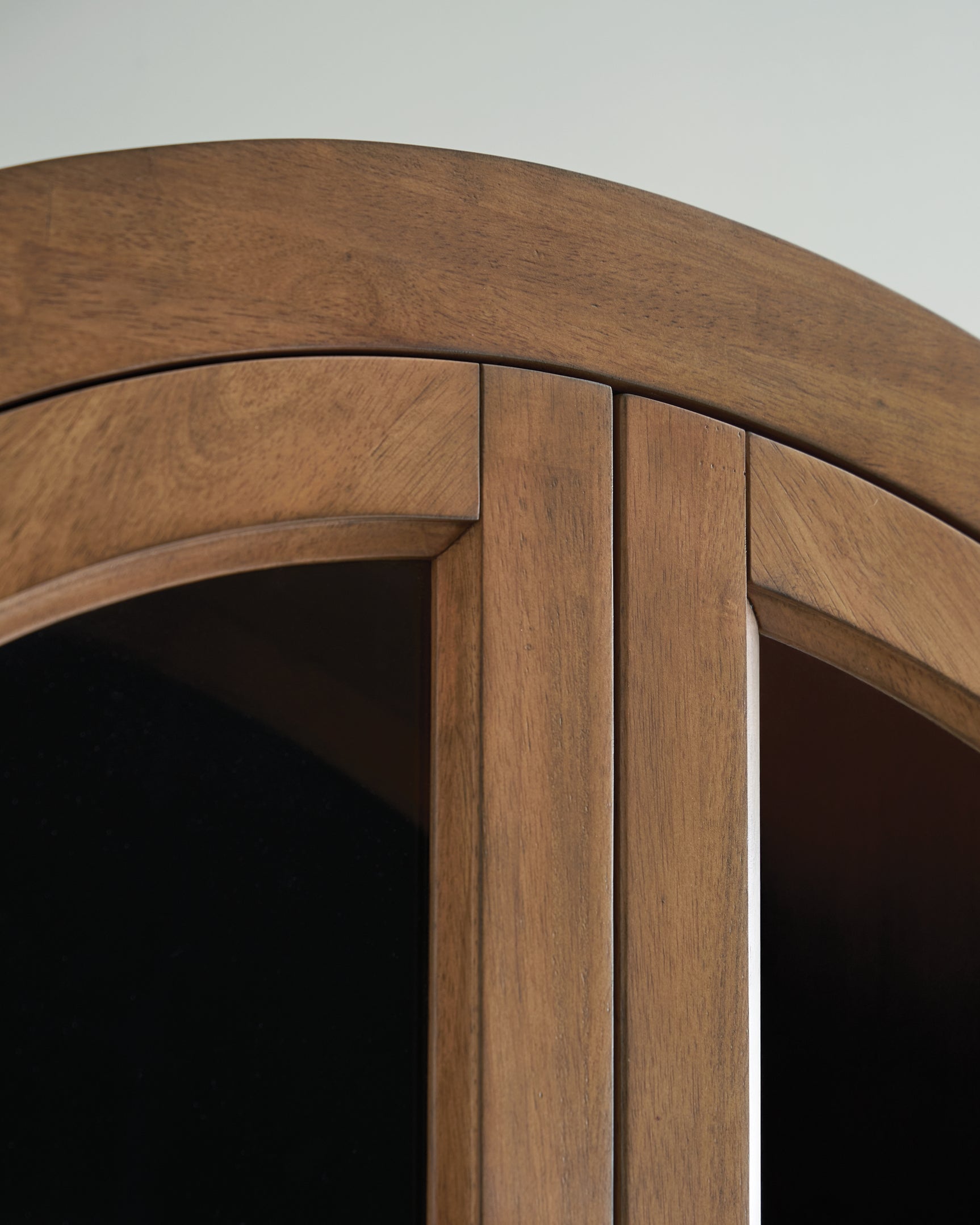 Close-up of Dagandale Accent Cabinet wood door pull and finish