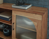 Close-up of cabinet door hardware and wood finish