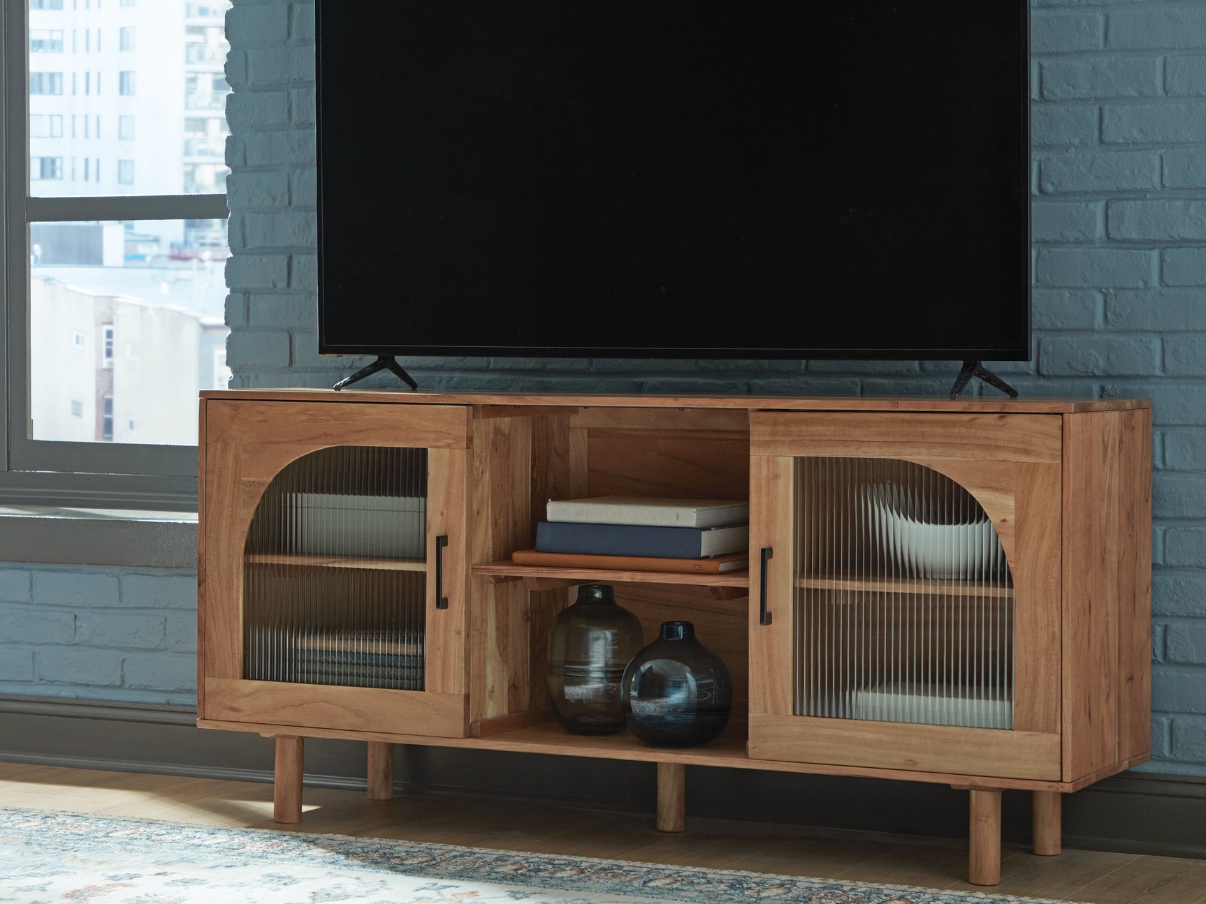 Accent cabinet used as TV stand with media devices