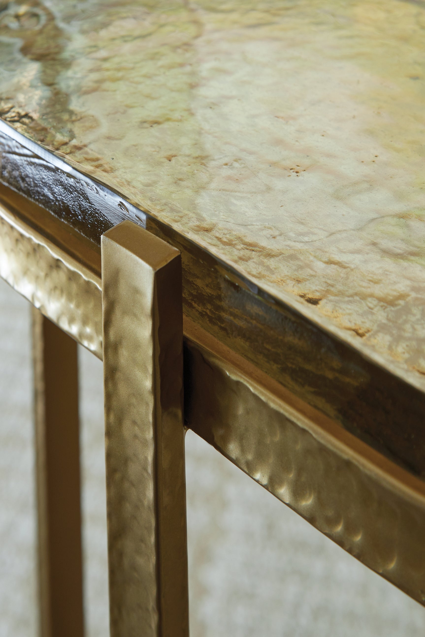 Close-up of gold plated metal frame finish of Porterville accent table