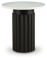 Side angle of Wainstone accent table showing fluted black metal base