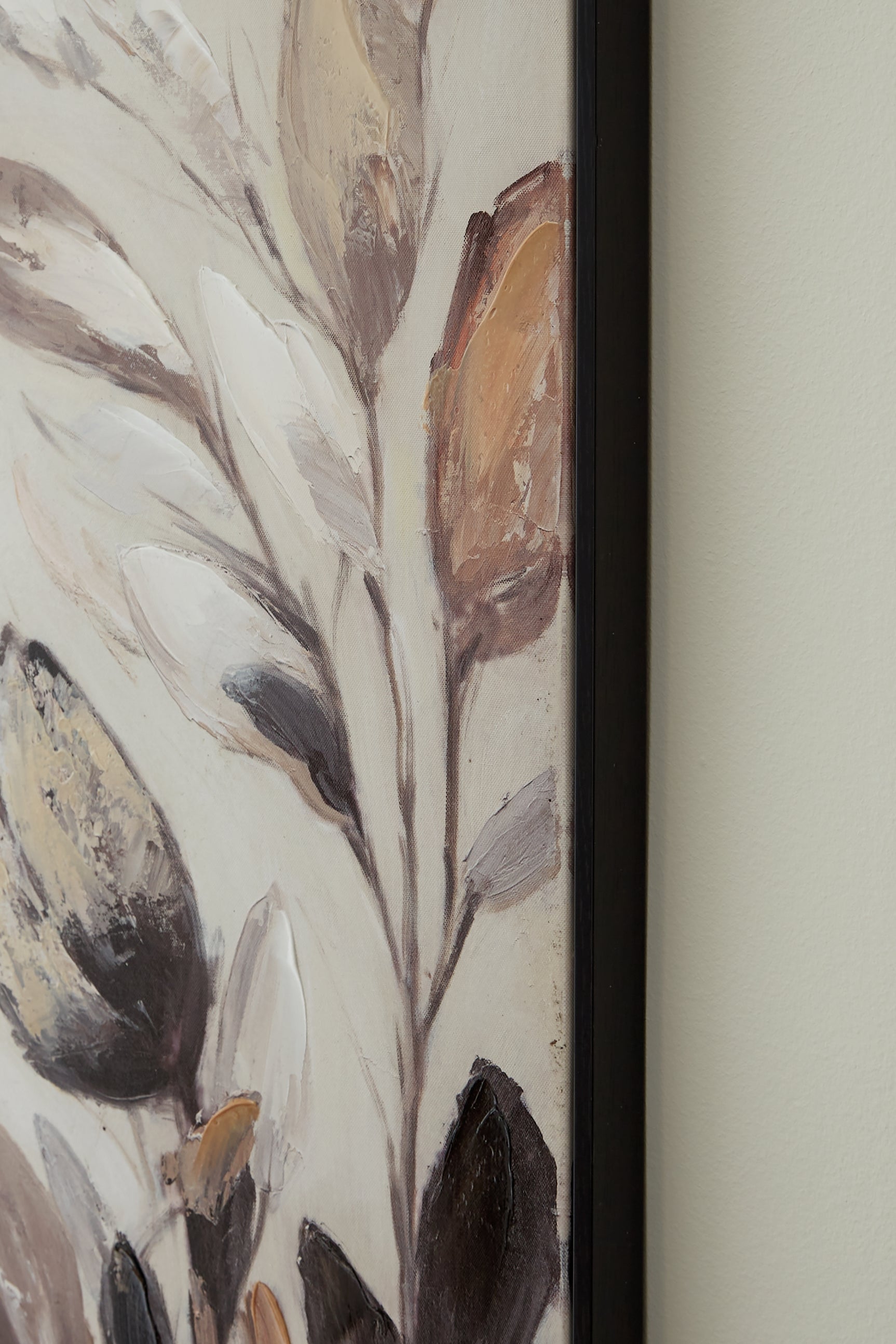 Close-up of hand-painted floral embellishments on Trulow art