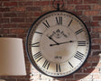 Augustina Antique Black Wall Clock front view showing Roman numerals and pendulum