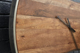 Detail view of Panchali wall clock metal trim and wood finish