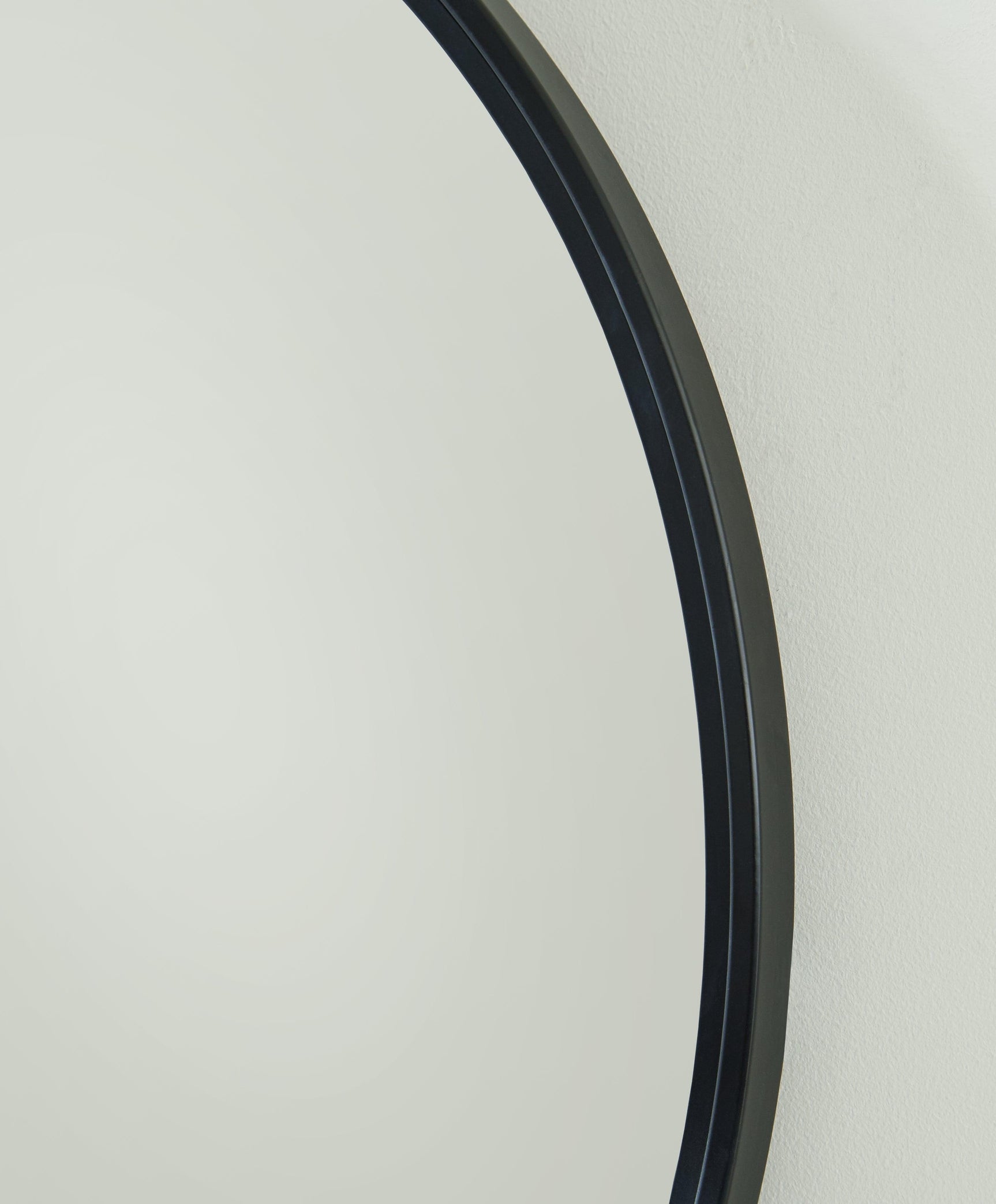 Close-up of Brocky Black Accent Mirror frame and beveled glass