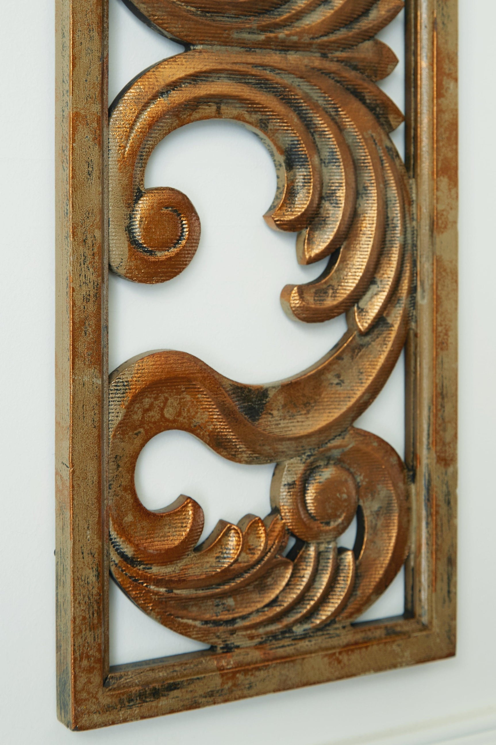 Close-up of Candelario Wall Decor scroll pattern and finish