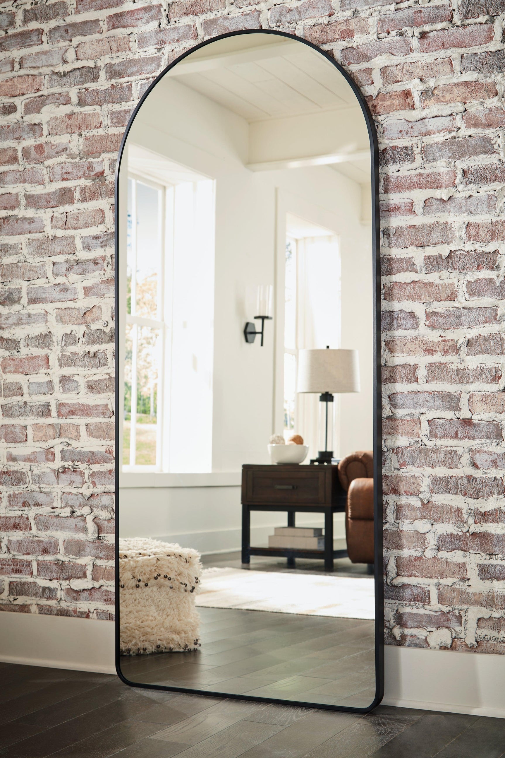 Sethall Black Floor Mirror leaned against wall