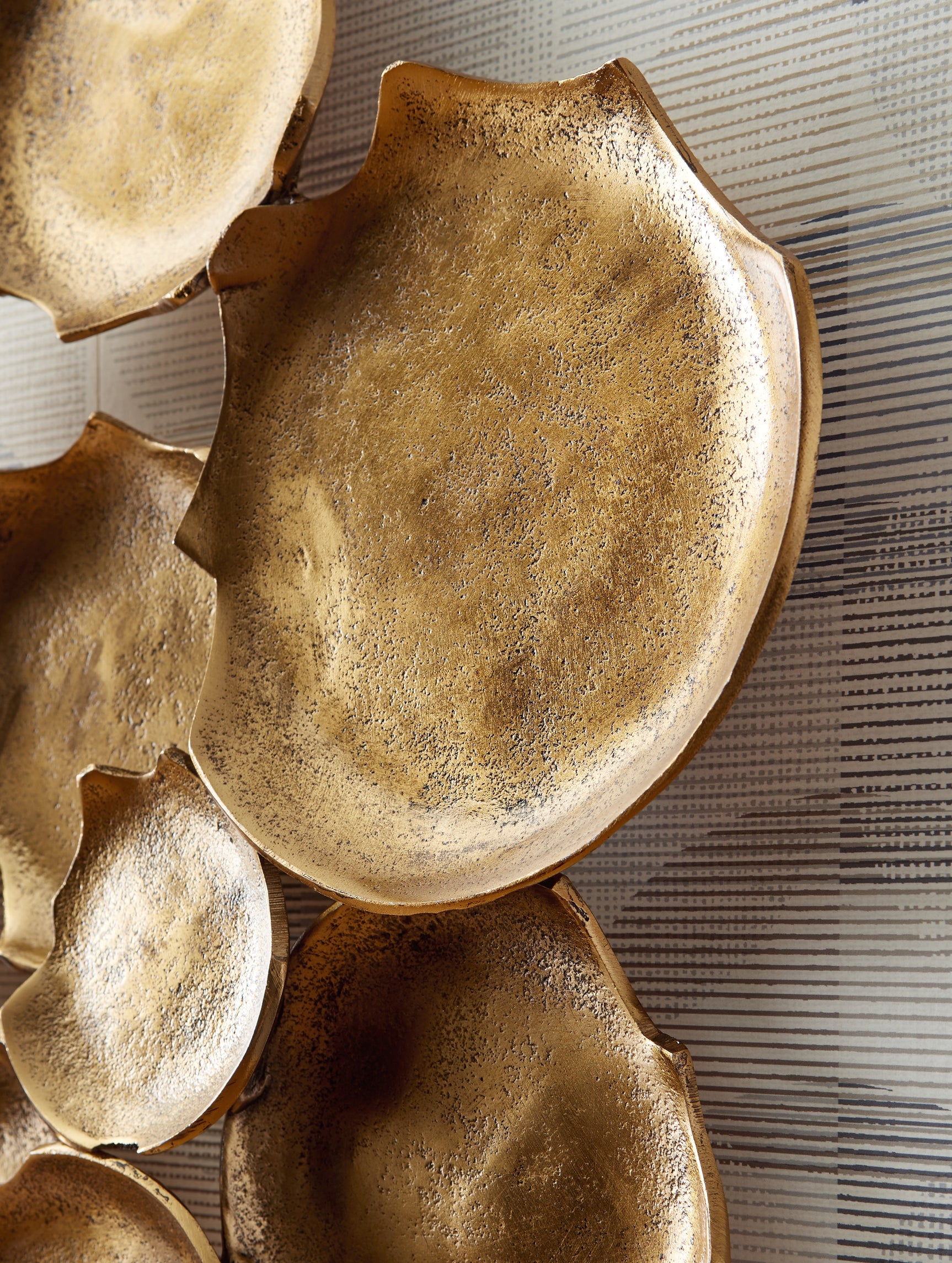 Close-up detail of Gageton antique gold finish and texture