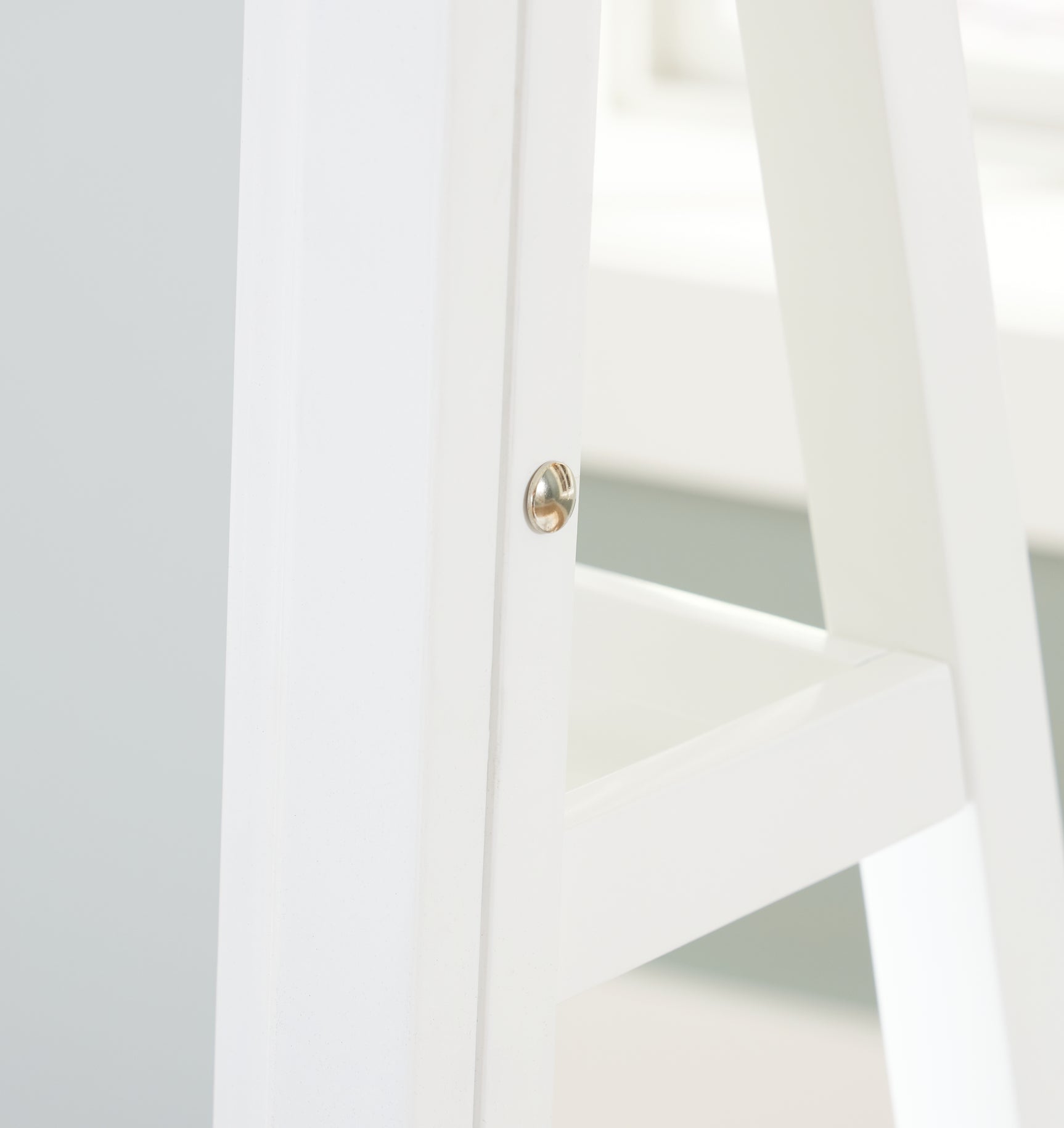 Side view of Evesen white floor-standing mirror with storage