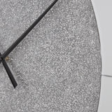 Reinport mirror wall clock hanging on wall in a contemporary living room