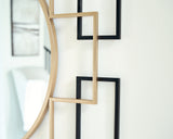 Oceanal accent mirror, close-up detail of black and gold finish frame