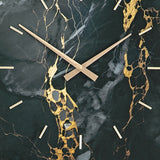 Swatch showing black and gold color pattern on clock