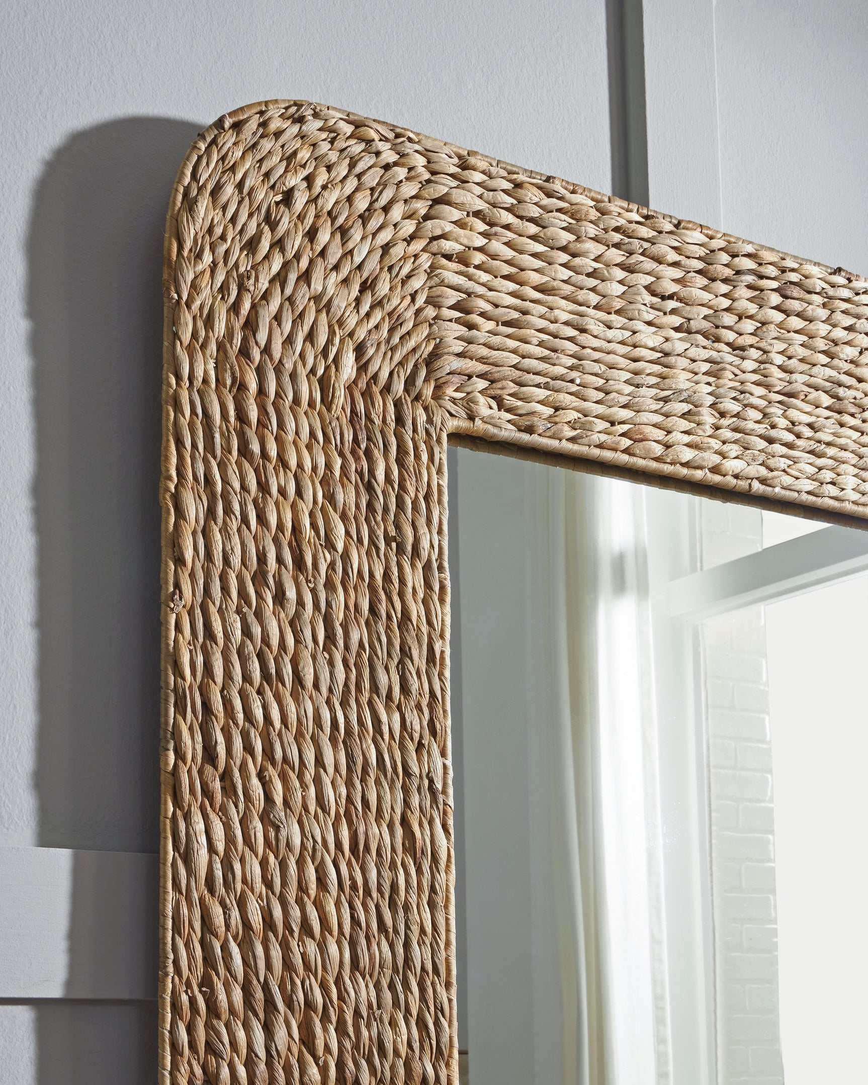 Close-up of Norigan Floor Mirror sea grass woven texture