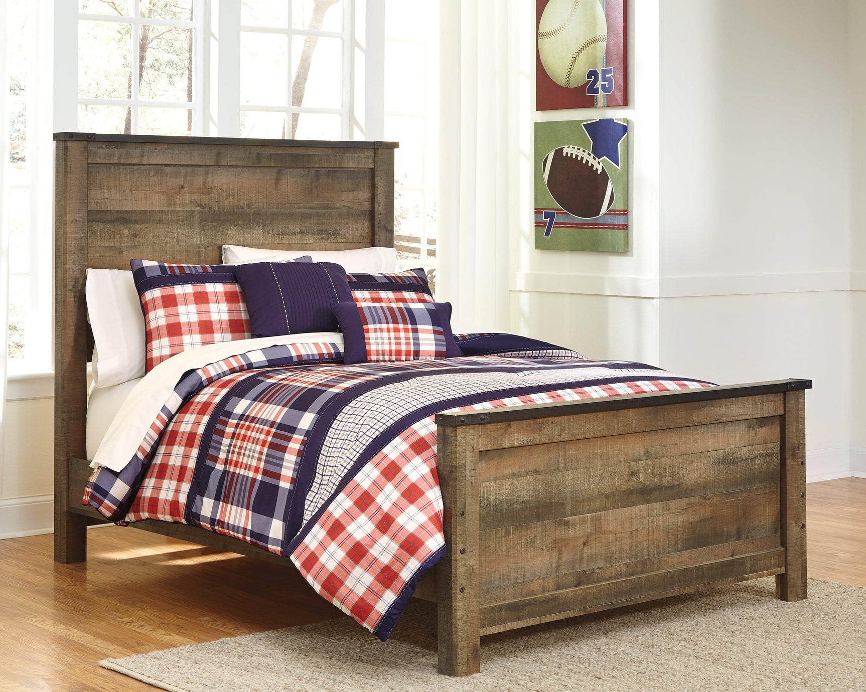 Trinell Full Panel Bed shown assembled in casual bedroom setup