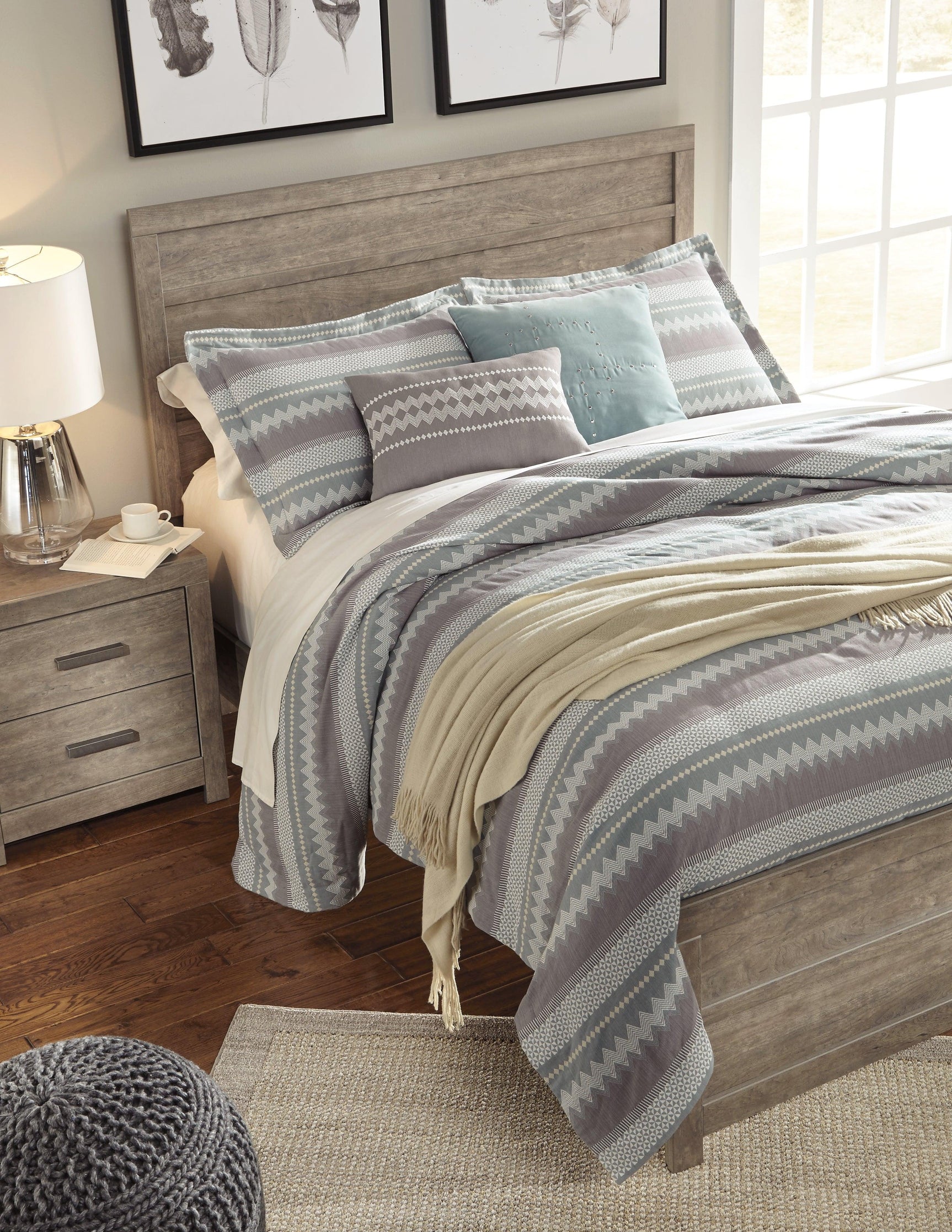 Low-profile footboard of Culverbach Gray Queen Panel Bed