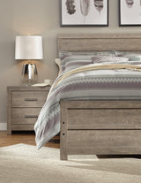 Culverbach Queen Panel Bed styled in bedroom setting