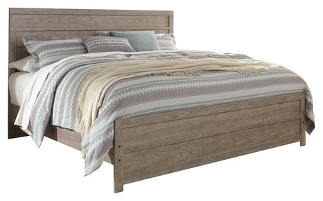 Side angle of Culverbach Gray King Panel Bed showing footboard drawers