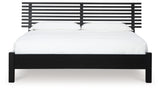 Close-up side view of Danziar Black Queen Slat Panel Bed frame