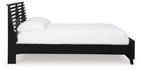 Danziar Black Queen Slat Panel Bed side angle showcasing matte finish