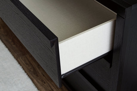 Faux linen lined drawer interior of Danziar dresser