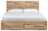Footboard with two storage drawers open on Hyanna queen bed