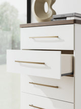 Detail of champagne-finished handle and drawer front