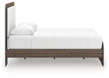 Detail of two-tone walnut grain and white matte finish on bed frame