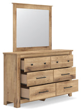 Open drawer of Makidern dresser showing storage space