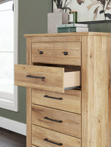 Close-up of dark bronze-tone drawer knobs on Makidern Chest
