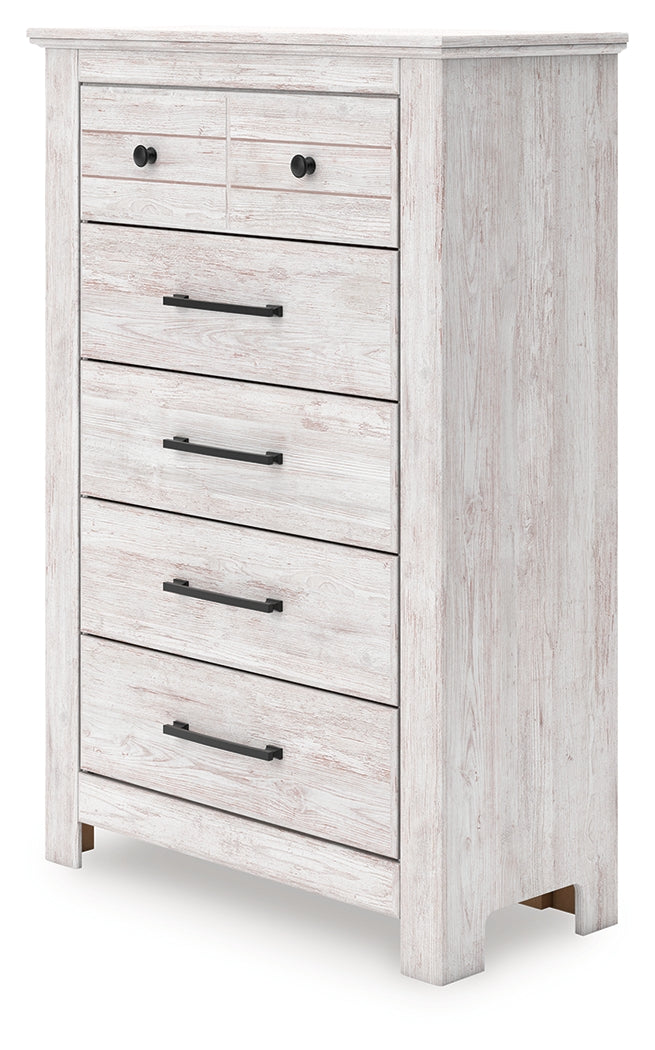 Side angle of Makidern whitewash chest of drawers