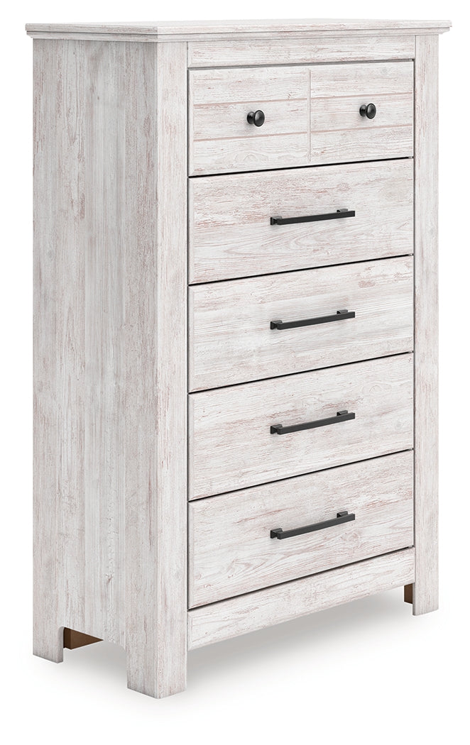 Makidern chest of drawers angled front view showing whitewash finish