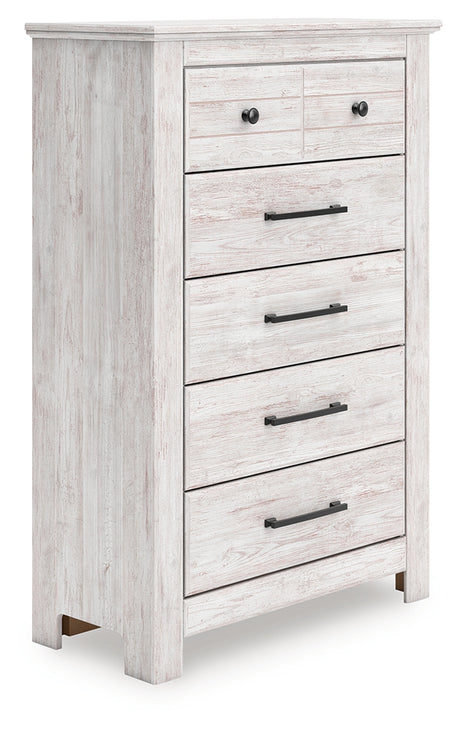 Makidern chest of drawers angled front view showing whitewash finish
