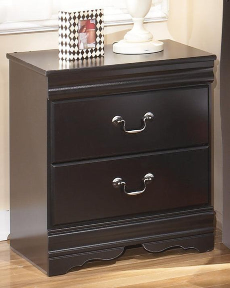 Huey Vineyard Black Nightstand angled view in bedroom setting