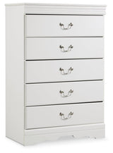 Close-up of aged pewter-tone drawer hardware on white chest