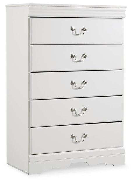 Close-up of aged pewter-tone drawer hardware on white chest