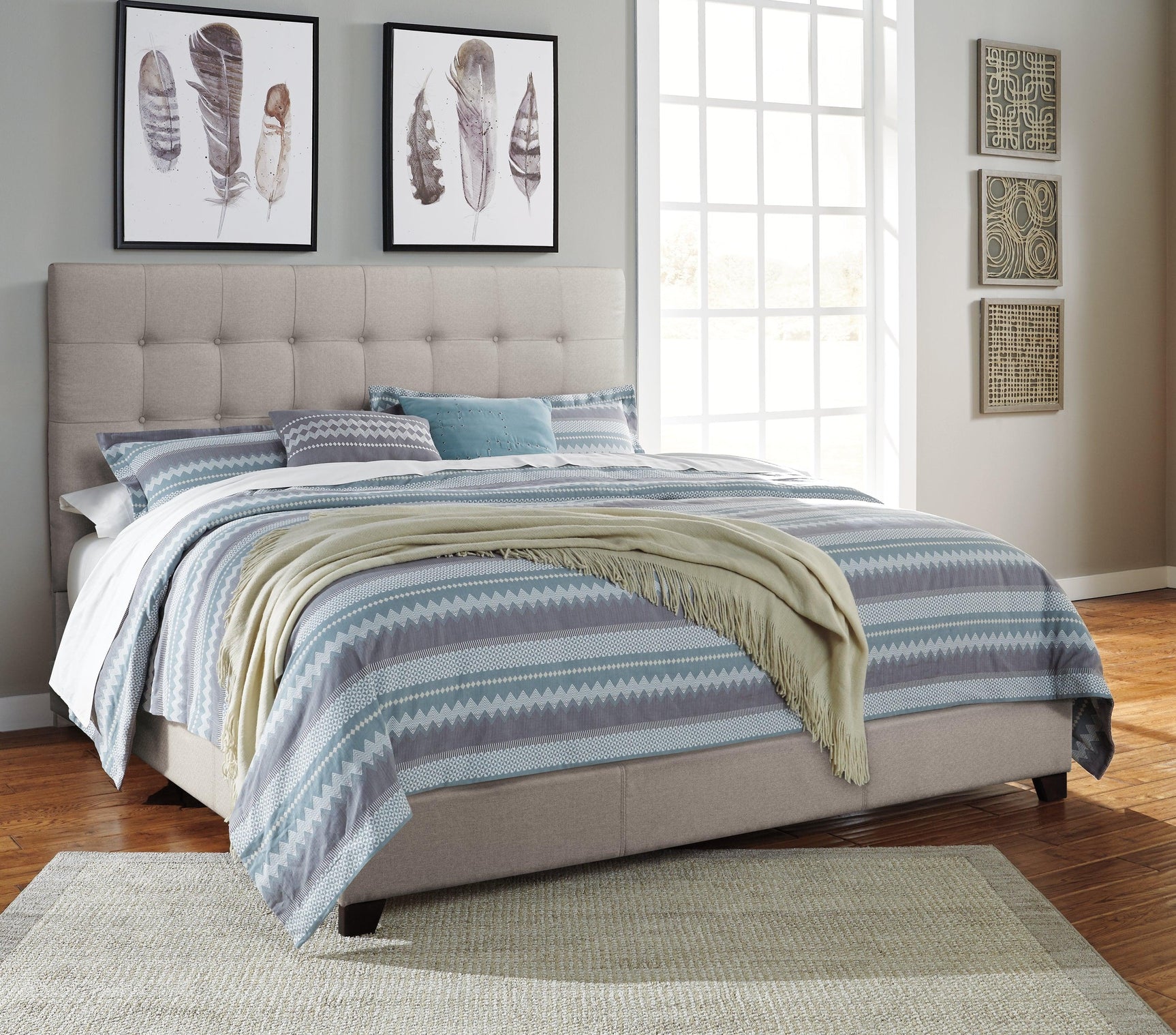 Dolante Beige King Upholstered Bed close-up of button tufted headboard