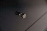 Detail of base molding on Maribel Black Dresser