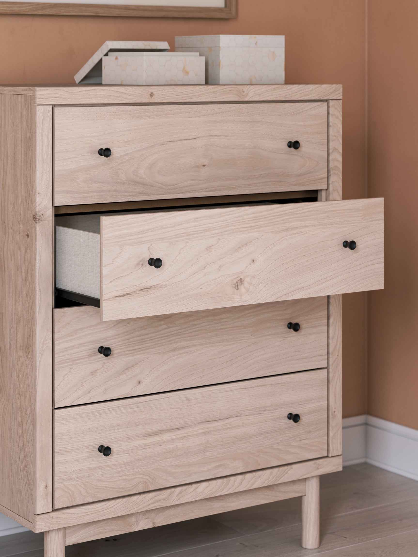 Arloster Tan Chest of Drawers wood grain and knob detail
