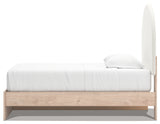 Knobs and upholstery detail on Arloster Twin Bed