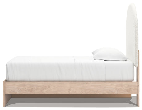 Knobs and upholstery detail on Arloster Twin Bed