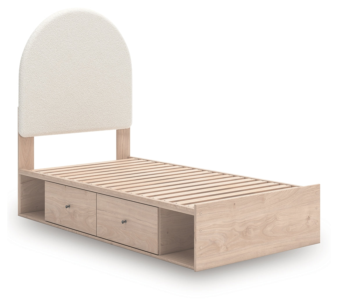 Open storage drawers under Shapella twin bed revealing interior lined with faux linen laminate