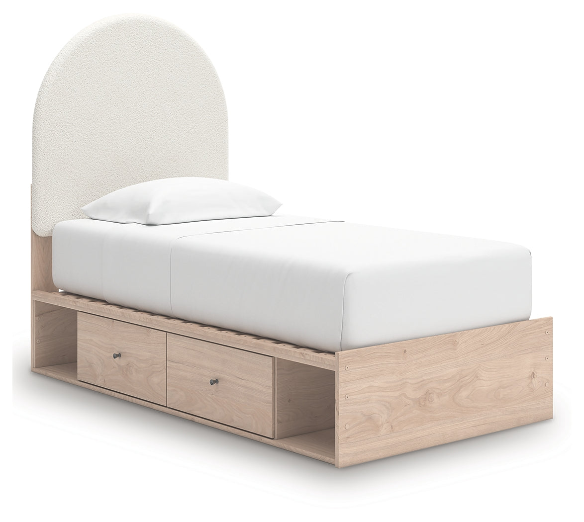 Side view of Shapella twin bed showcasing profile and storage cubbies