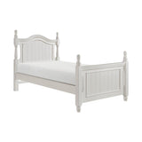 Close-up of turned post headboard in white finish
