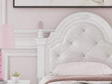 Close-up of button-tufted upholstery and LED lighting on headboard