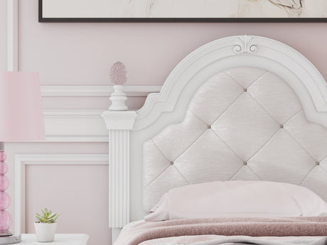 Close-up of button-tufted upholstery and LED lighting on headboard