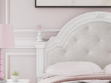 Close-up of headboard with ornate beading and tufting