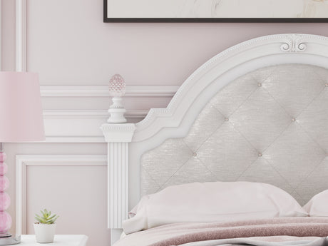 Close-up of headboard with ornate beading and tufting