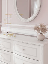 Detail of bun feet and decorative laminate on Kozlani dresser